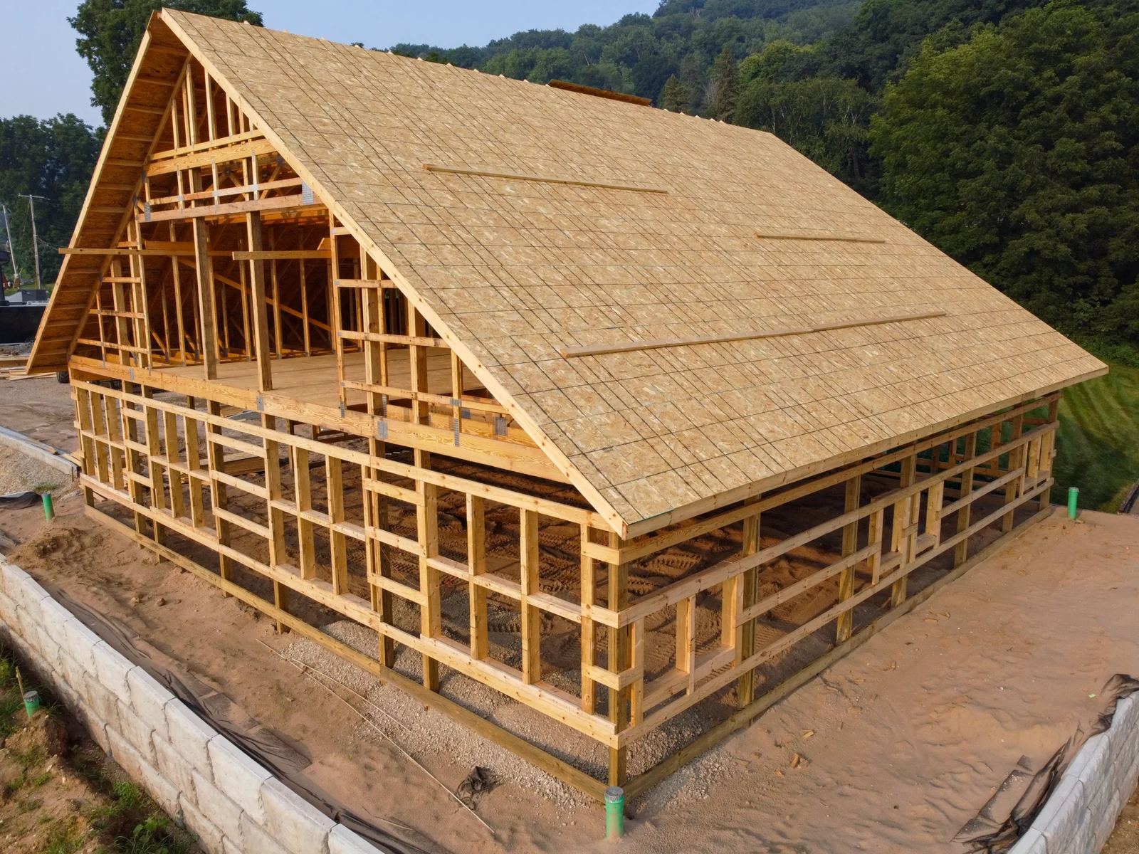 Metal-sided post-frame building with overhead doors